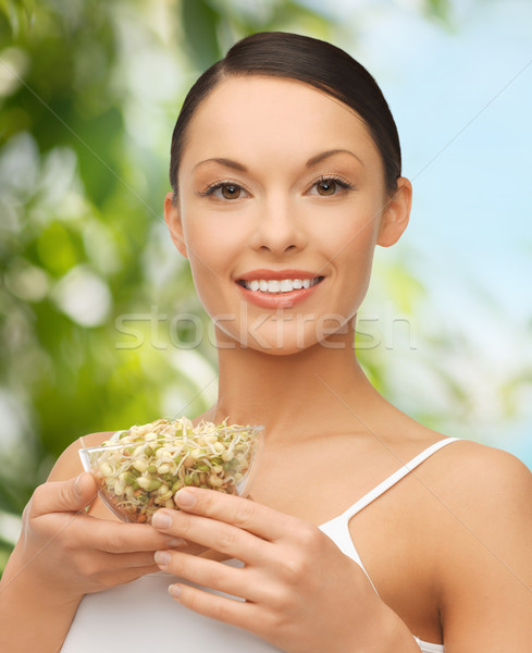 healthy woman holding bowl with sprout Stock photo © dolgachov