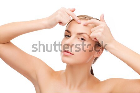 young woman squeezing acne spots Stock photo © dolgachov