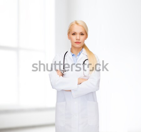 serious female doctor with stethoscope Stock photo © dolgachov