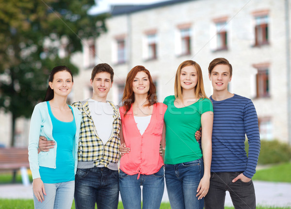group of smiling students standing Stock photo © dolgachov