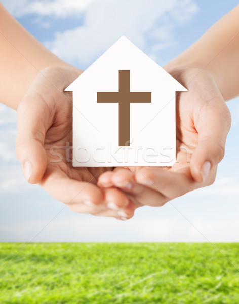 close up of hands and paper house with cross Stock photo © dolgachov
