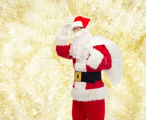 man in costume of santa claus with bag Stock photo © dolgachov