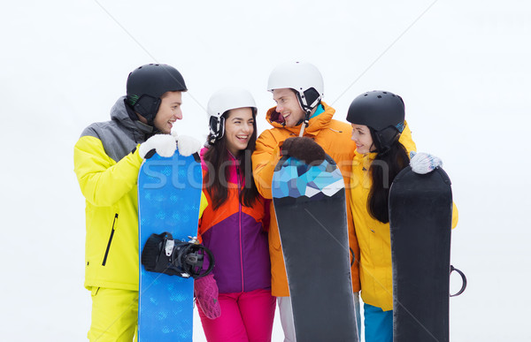 happy friends in helmets with snowboards talking Stock photo © dolgachov