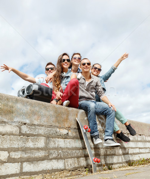 group of smiling teenagers hanging out Stock photo © dolgachov