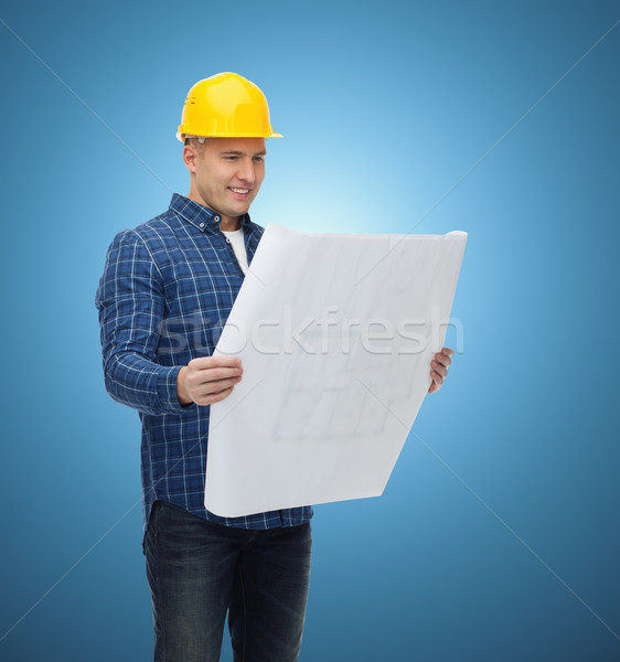 smiling male builder in helmet with blueprint Stock photo © dolgachov