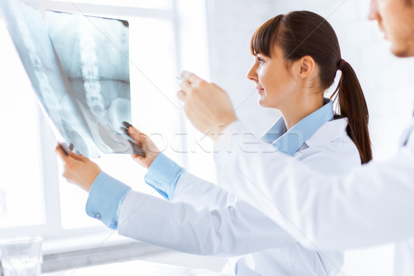 doctor and nurse exploring x-ray Stock photo © dolgachov