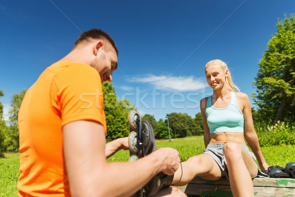 happy couple with roller skates outdoors Stock photo © dolgachov