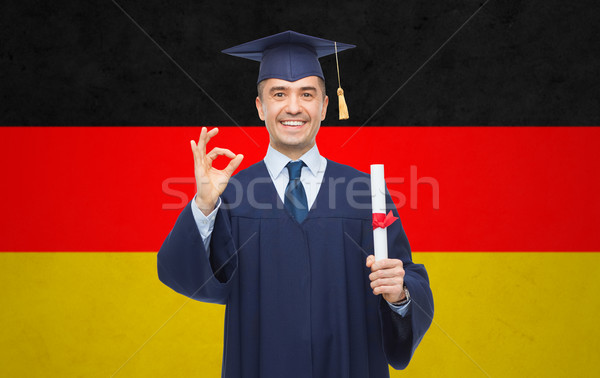 Sonriendo adulto estudiante diploma educación graduación Foto stock © dolgachov