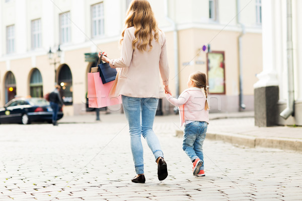 close up of mother and child shopping in city Stock photo © dolgachov