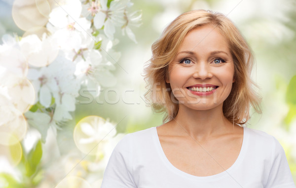 smiling woman in blank white t-shirt Stock photo © dolgachov