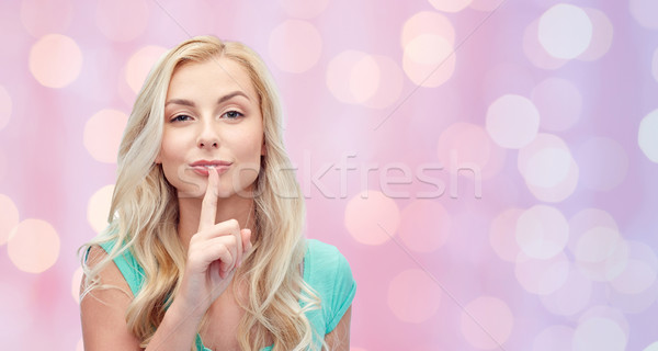 Belo mulher jovem dedo lábios pessoas Foto stock © dolgachov
