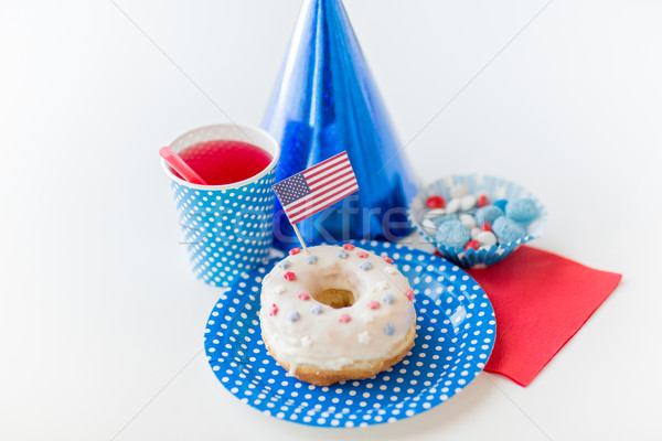 donut with juice and candies on independence day Stock photo © dolgachov
