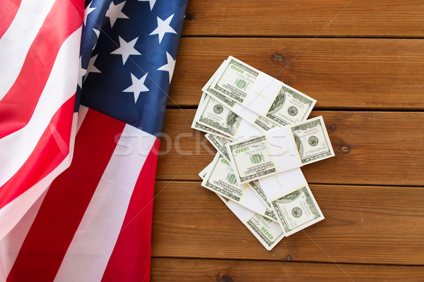 close up of american flag and dollar cash money Stock photo © dolgachov