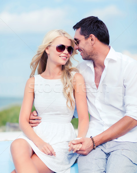 couple in shades at seaside Stock photo © dolgachov