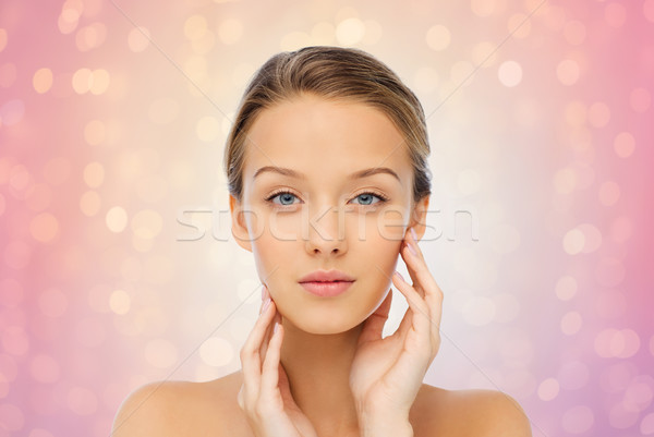 young woman touching her face Stock photo © dolgachov
