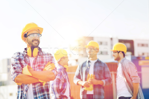 Groupe souriant constructeurs extérieur affaires bâtiment [[stock_photo]] © dolgachov