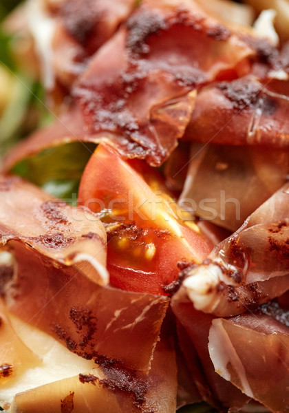 close up of prosciutto ham salad Stock photo © dolgachov