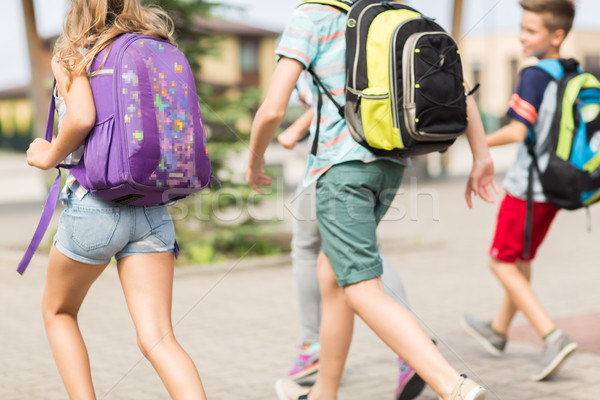 Groupe heureux école élémentaire élèves courir primaire [[stock_photo]] © dolgachov