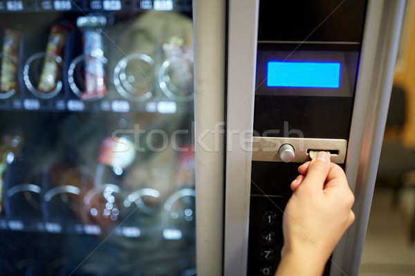 hand inserting euro coin to vending machine slot Stock photo © dolgachov