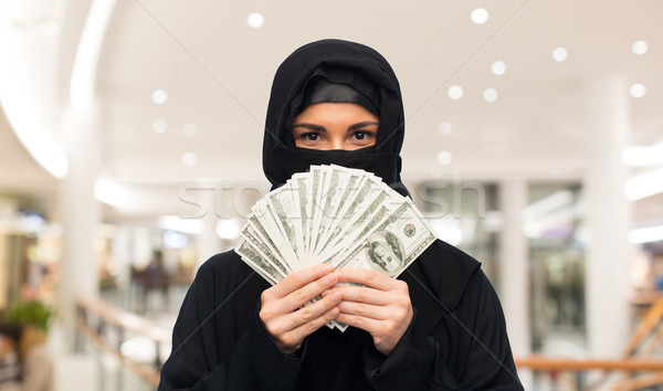 muslim woman in hijab with money over white Stock photo © dolgachov