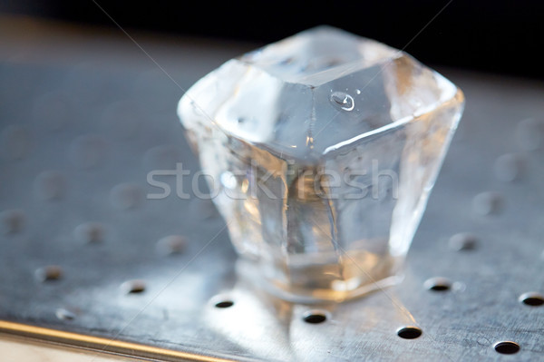 hand-cut ice cube at bar Stock photo © dolgachov