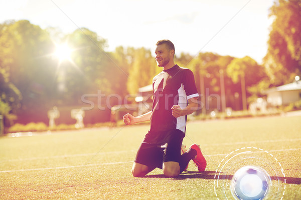 Heureux footballeur balle terrain de football sport succès [[stock_photo]] © dolgachov