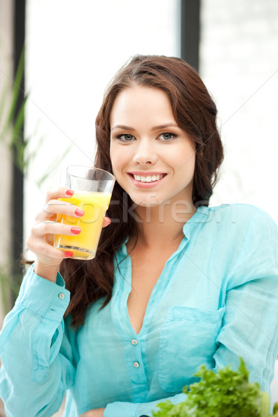 beautiful woman with glass of juice Stock photo © dolgachov