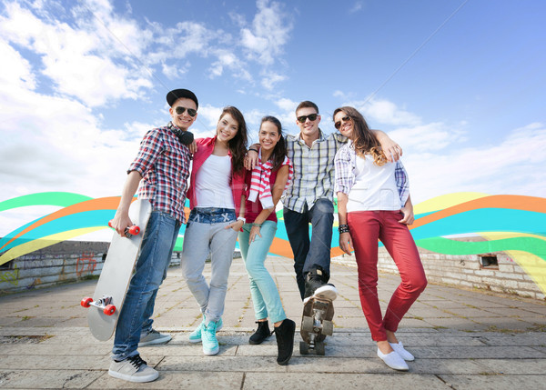 teenagers with skates outside Stock photo © dolgachov