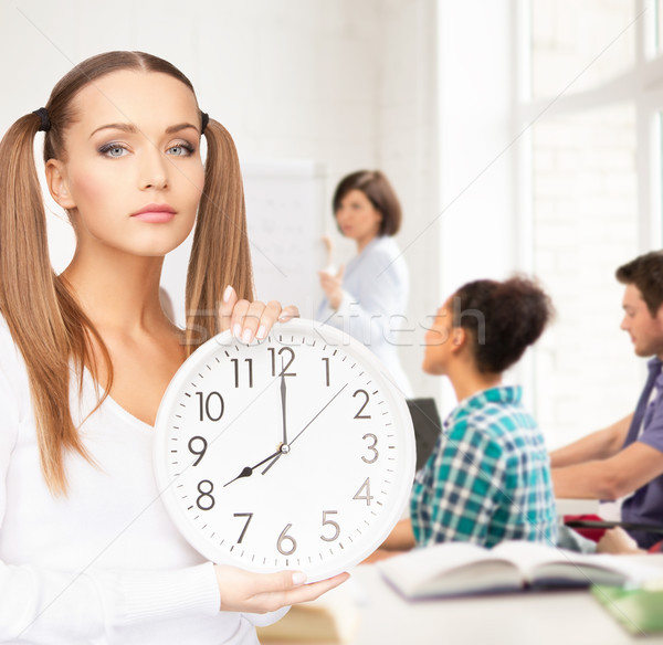 student showing clock Stock photo © dolgachov