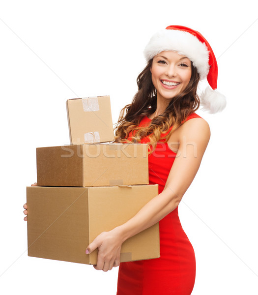 smiling woman in santa helper hat with parcels Stock photo © dolgachov