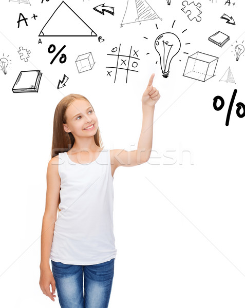 girl in white shirt pointing to idea Stock photo © dolgachov
