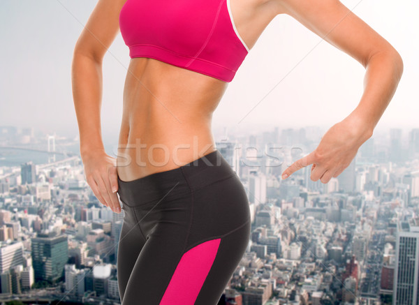 Femme pointant fitness [[stock_photo]] © dolgachov