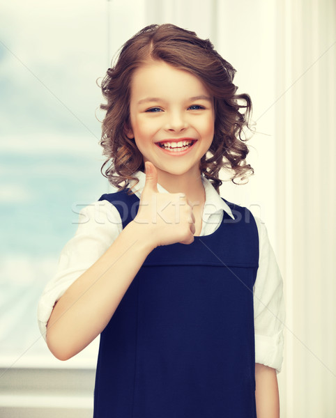 pre-teen girl showing thumbs up Stock photo © dolgachov