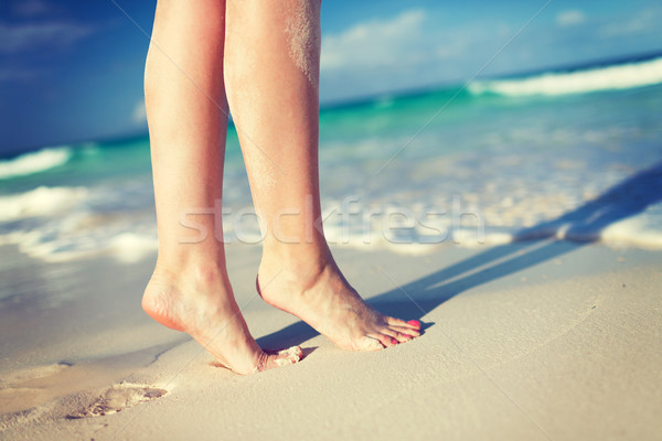 closeup of woman legs on sea shore Stock photo © dolgachov