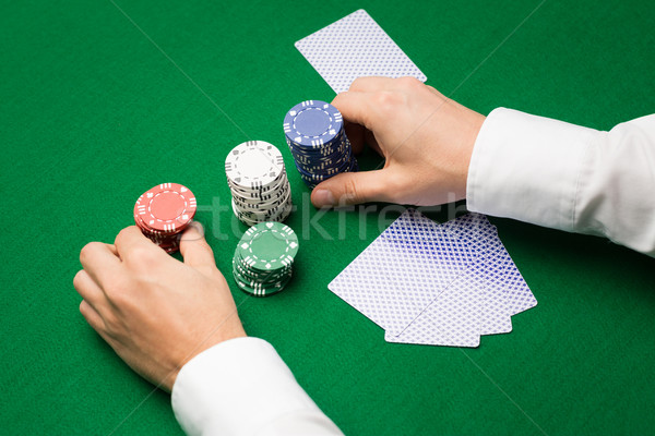 holdem dealer with playing cards and casino chips Stock photo © dolgachov