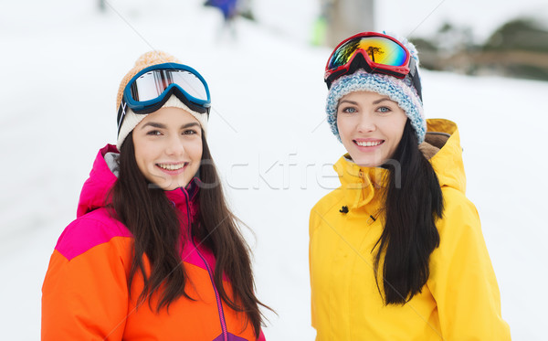 happy girl friends in ski goggles outdoors Stock photo © dolgachov