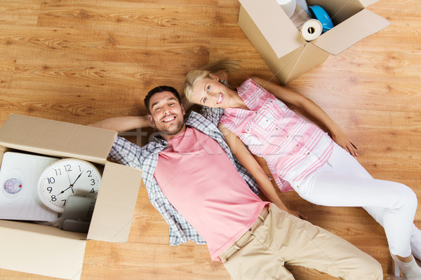 couple with big cardboard boxes moving to new home Stock photo © dolgachov