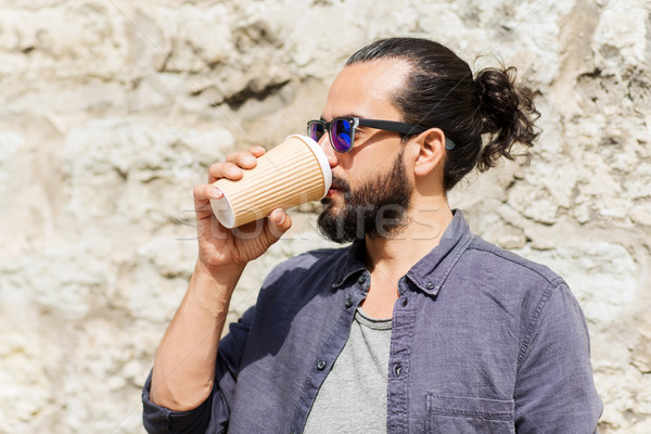 man drinking coffee from paper cup on street Stock photo © dolgachov