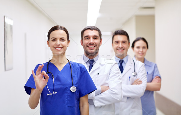 Stock photo: group of happy medics or doctors at hospital