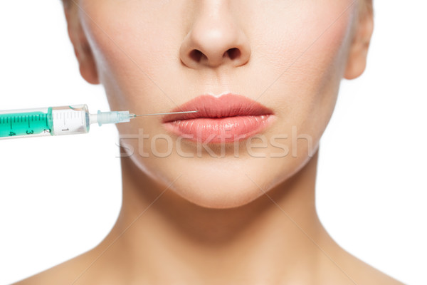 Cara da mulher seringa injeção pessoas cirurgia plástica Foto stock © dolgachov