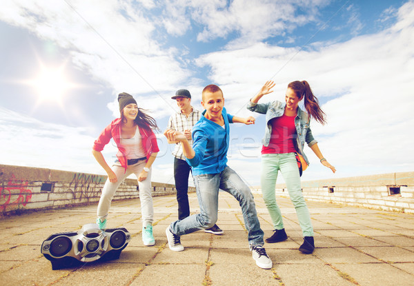 group of teenagers dancing Stock photo © dolgachov