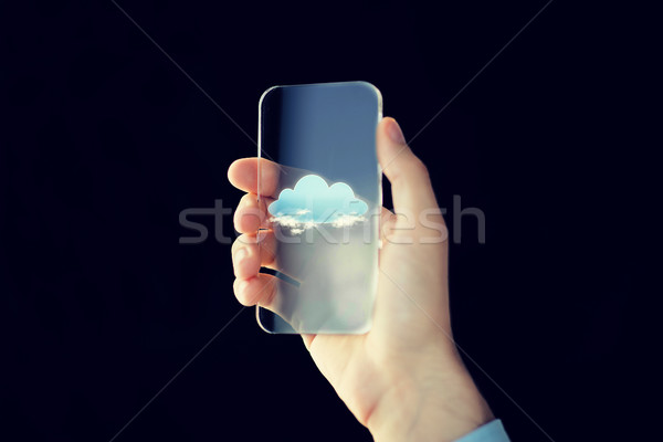 close up of male hand with transparent smartphone Stock photo © dolgachov