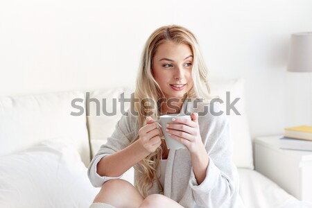 happy young woman in warm pullover at home Stock photo © dolgachov