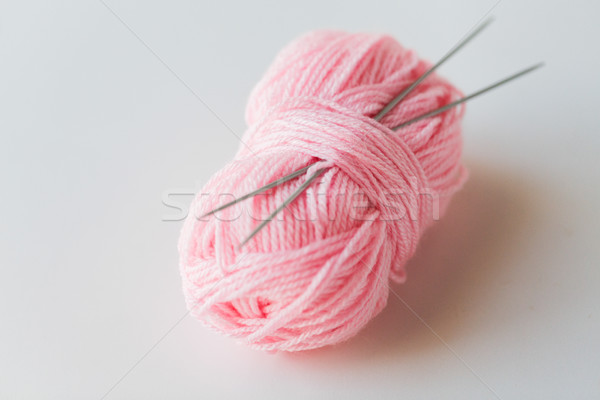 knitting needles and ball of pink yarn Stock photo © dolgachov