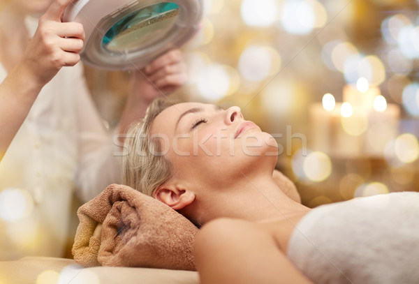 close up of young woman lying in spa Stock photo © dolgachov