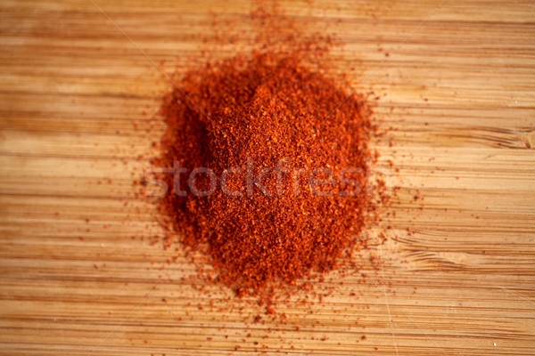 cayenne pepper or paprika powder on wood Stock photo © dolgachov