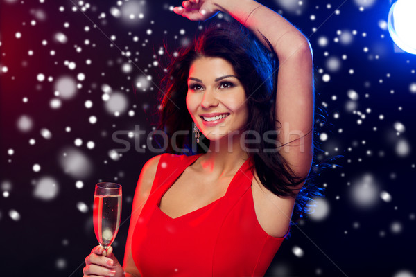 beautiful woman with champagne glass at nightclub Stock photo © dolgachov