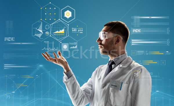 doctor or scientist in lab coat and safety glasses Stock photo © dolgachov