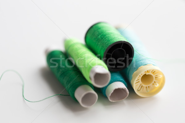 green and blue thread spools on table Stock photo © dolgachov
