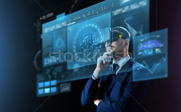 businessman in virtual reality headset and screens Stock photo © dolgachov